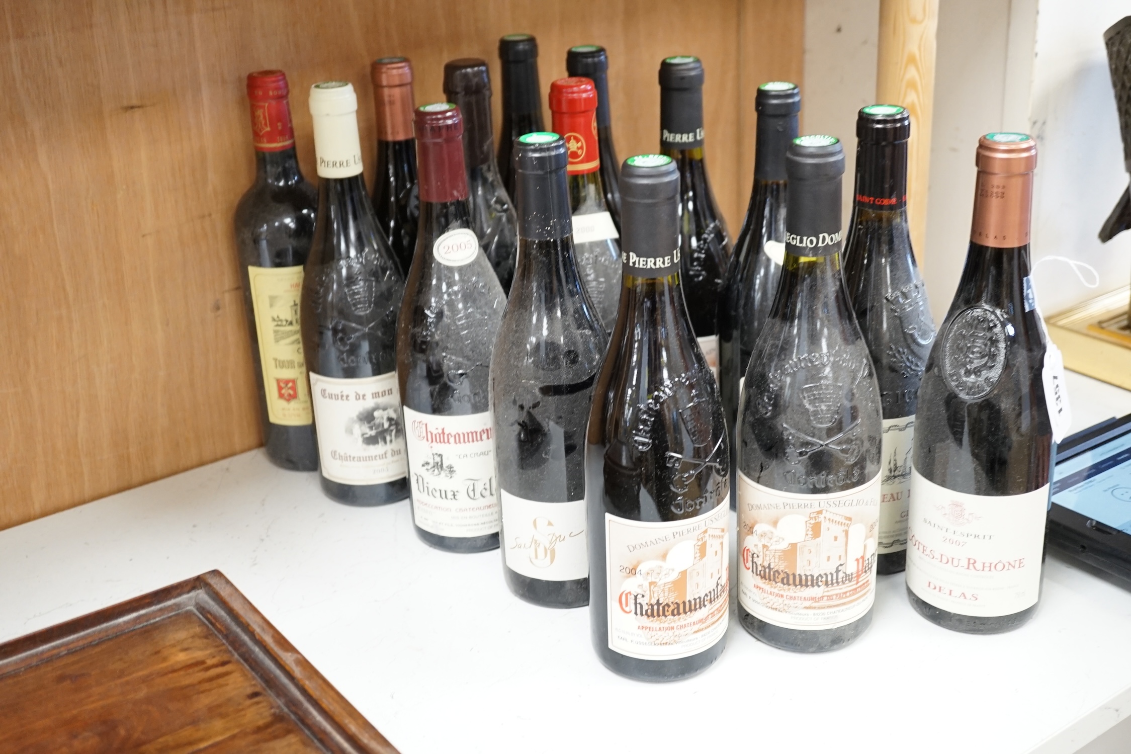Eighteen bottles of wine to include Domaine Pierre Usseglio & Fils Châteauneuf du Pape 2004, Baronnie d’Estouard Châteauneuf du Pape 2003, Châteauneuf du Pape 2005 Vietcong Telegraphe, Châteauneuf du Pape 2000 Les Taillo